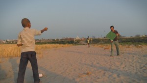 Make friends and have fun. Sean and Rishabh fly a kite at the bank of Yamuna river, Vrindavan, India. A still from the multi-award winning film 'Reconnection'.