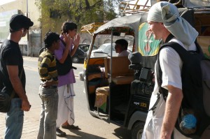The crew watches as Radha Mohan Rajani, the 1st AC and a translator, talks the driver through  the scene where a rickshaw hits Armand Gachet (left), film lead actor. Let's just hope he understands the 'breaks' part right! On the set of the 'Reconnection', a multi-award winning film.