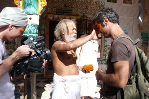 An unusual make-up, native style. A local sadhu decorates Armand Gachet, the lead actor of the film, with a sandal wood paste. At the set of  the 'Reconnection', a multi-award winning film.