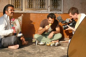 One man eats.. Filming the village lunch scene from the 'Reconnection', a multi-award winning film.